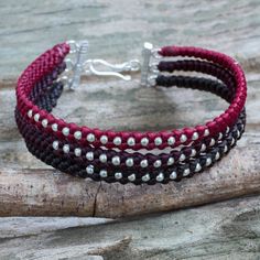 Silver beads shine brightly among the dark red maroon and dark brown strands that make up this trendy wristband. Napapat crafts the bracelet by hand with hill tribe stylizations and a sterling silver clasp. Adjustable Burgundy Round Bead Bracelets, Adjustable Burgundy Bracelets, Adjustable Burgundy Bracelet, Handmade Burgundy Bracelets As Gift, Handmade Burgundy Bracelet As A Gift, Brown Strands, Dark Red Maroon, Wristband Bracelet, S Hook