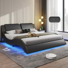 a bedroom with a bed that has blue lights on the headboard and foot board