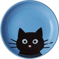 a blue plate with a black cat painted on it