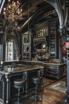 an ornate kitchen with black cabinets and chandelier