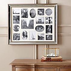 a wooden table topped with a dresser covered in pictures