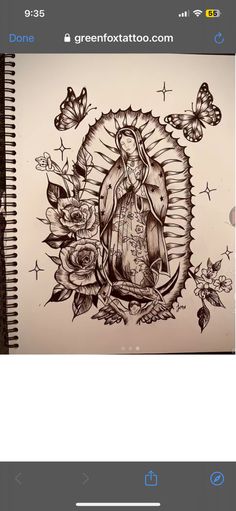 a drawing of a virgin mary surrounded by flowers and butterflies on a notepad with the text green fox tattoo