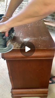 a person using a grinder on a wooden table