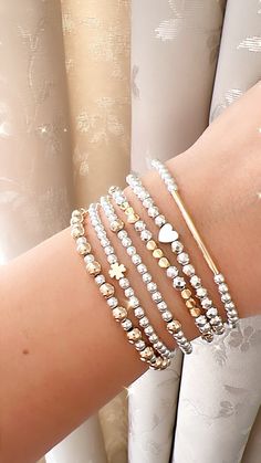 Two tone bracelet, gold and silver bracelet, mixed metal jewelry, elegant, dainty, minimalist bracelet stack, birthday gift for her, for mom Dainty, and elegant beaded bracelets !  ❣️Listing includes One bracelet. You can choose one or more bracelets, or the entire stack ( SUPER DEAL ❣️)  ❣️CREATE YOUR OWN STACK ❣️ These make fun, personalized gifts for moms, bachelorette parties, bridal showers, kids, flower girls, best friends...etc! Try personalizing with names, kids names, special words, phrases or affirmations, too  They are a stylish addition to any outfit, perfect for mixing, matching and stacking. The jewelry cord is elastic and will stretch slightly with wear.  - gold plated beads *long lasting color*   - silver hematite  Can be personalized. 🤍 ⭐️ Customise a bracelet with your n Two Tone Bracelet, Gold And Silver Bracelets, Jewelry Elegant, Mixed Metal Jewelry, Super Deal, Kids Names, Personalized Gifts For Mom, Wedding Jewelry Bracelets, Minimalist Bracelet