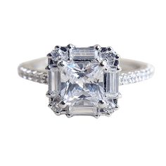 an engagement ring with a princess cut diamond in the center