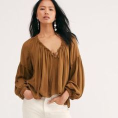 Free People Banda Blouse Nwt Size Small Ginger Snap New With Tag This Oversized, Boho Blouse Features A Front Tie Detail With A Flowy Silhouette, Exposed Seaming, & Ruched Hemlines. Exaggerated Sleeves With Pleating Throughout The Top. The Color Is Similar To Toasted Chestnut. If You Have A Short Torso The Length Will Not Be Cropped For You. Short Length Front & Back. Color Lighter Than Stock Pic. Exposed Seaming Drapey Silhouette Body Length Approx 23” Sleeve Length Approx 28” Elegant V-neck Peasant Top For Fall, Fall Daywear Tops With Blouson Sleeves, Fall Beach V-neck Blouse, Casual Brown Blouse With Relaxed Fit, Casual V-neck Peasant Top For Fall, Neutral Long Sleeve Top For Summer, Fall Peasant Top For Day Out With Relaxed Fit, Casual Beige Blouse For Fall, Bohemian V-neck Top With Blouson Sleeves