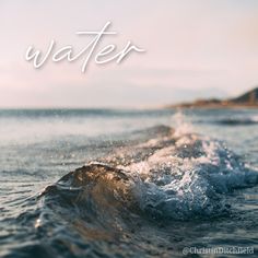 the water is splashing on top of the waves in the ocean with words above it that read, water