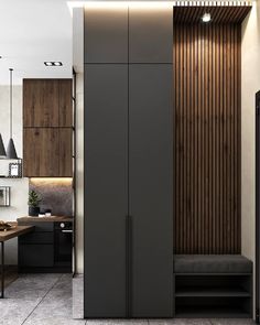 a modern kitchen with wood paneling on the walls and floor, along with black cabinets