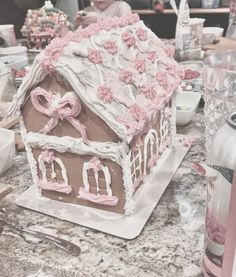 a cake shaped like a house sitting on top of a table