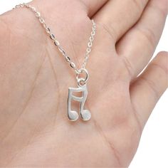 (1)Metal Material: sterling silver (2)Music Note Size: length 18mm, width 9mm, ring hole 4mm (3)Clasp Type: lobster clasp (4)Link Size: 1.6x2.1mm (5)Chain Length: 18, 20, 22, 24 inches (6)Package: in a bubble emailer For more necklaces, please find here: https://www.etsy.com/shop/LBCreatives?ref=seller-platform-mcnav&section_id=24284749 We offer free standard shipping for all orders. Also, we provide 10% off for orders more than $250. You don't need to apply any coupon. The system will calculate Nickel-free Silver Jewelry For Concerts, Sterling Silver Jewelry For Concerts, Music-themed Sterling Silver Necklace, Silver Sterling Music-themed Necklace, Nickel-free Silver Music-themed Necklaces, Music-themed Silver Pendant Necklace, Sterling Silver Music-themed Pendant Necklace, Music-themed Sterling Silver Pendant Necklace, Nickel-free Sterling Silver Music-themed Necklace