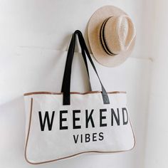 The Weekend Getaway Tote Bags call for two plane tickets and a cocktail! We know you are going to love them as much as we do. Materials: Canvas, PU Leather, Cotton 100% cotton canvas tote bag PU leather handles 20"L x 5"W x 11"H 11.2 oz Trendy Canvas Vacation Bag, Casual Canvas Bags For Weekend, Casual Canvas Shoulder Bag For Weekend, Casual Canvas Beach Bag For Weekend, Trendy White Travel Canvas Bag, Trendy White Canvas Travel Bag, Trendy White Canvas Bag For Travel, Trendy Travel Bag For Weekend Trips, Summer Weekend Cotton Bags