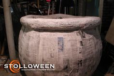 a large stone urn sitting in the middle of a room