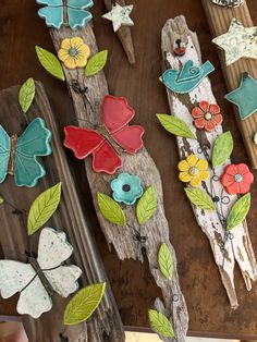 some wooden pieces with flowers and leaves on them