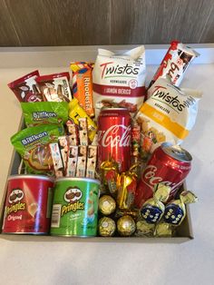 an assortment of snacks and candy in a box