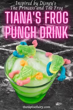 the princess and the frog punch drink is in a green glass with gummy bears on top