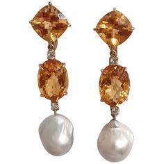 "18kt Yellow Gold Elegant Three Stone Drop Earrings with two Citrine and Baroque Pearl and Diamonds Faceted Cushion, Oval, and then Baroque Pearl finished with four diamonds ~0.60cts.  These earrings measure 2 1/2\" in length and 1/2\" wide. The earrings can be made for Clip Earring or Pierced Earrings.  They can also be custom made with any color stone combination.  Please contact me with any inquiries you may have.  Best, Christina" Stone Drop Earrings, Pearl Jewelry Design, Gold Link Bracelet, Pink Topaz, Drop Earring, Accessories Jewelry Earrings, Baroque Pearls, Three Stone, Estate Jewelry