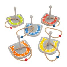 four wooden toys with ropes and magnets on them