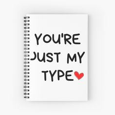 a spiral notebook with the words you're just my type written in black ink