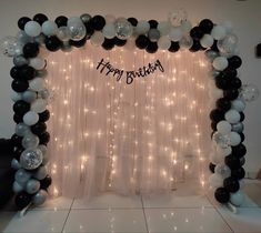 a birthday decoration with balloons and streamers