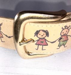 Little Children Design  Encircles Light Leather Belt   W  1 1/4"  size Lg.  to 31-35"   Vintage made in the USA. Some tarnish on buckle. See pictures for details.  Leather and print looks and feels like it was never worn. Adjustable Gold Belt Buckle As Gift, Antique Adjustable Belt Buckles For Gifts, Handmade Adjustable Belt Buckles As Gift, Adjustable Gold Belt As A Gift, Suspender Belt, Kids Design, Suspenders, Auburn, Made In The Usa