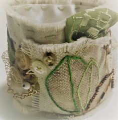 a close up of a cloth bag with buttons and other items on the inside of it