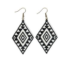 Introducing one of our first designs... Senu. Handcrafted with Miyuki beads to create an eye-catching large diamond-shaped black and white tribal design. Bring culture to your wardrobe with the mesmerizing indigenous pattern! Nordic Beaded Earrings, Diamond Shape Beaded Earrings, Indigenous Pattern, Smudge Fans, Aztec Earrings, Beadwork Ideas, Native Earrings, Miyuki Beads Pattern, Seed Bead Jewelry Patterns