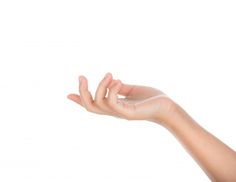 a person's hand is holding something in the air with their left thumb up