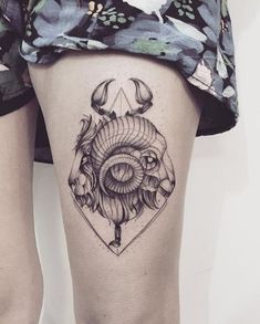 a woman's thigh with an animal tattoo on it