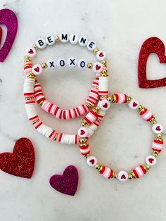 valentine's day bracelets with the words be mine, xoxo and hearts