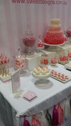 a table topped with lots of desserts and candies