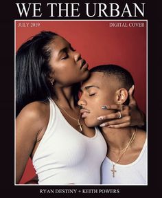 two young women embracing each other in front of a red background, one with her eyes closed