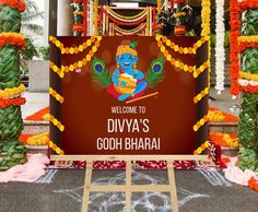 welcome to divya's godh bharji in front of an entrance