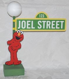 the sesame street sign has an elm street name on it