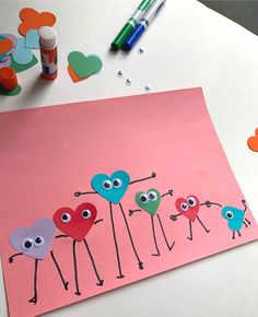 an art project for kids to make with colored paper and crayons on the table