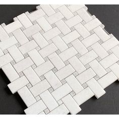 white marble mosaic tile on black background