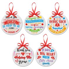 four personalized christmas ornaments with red ribbon