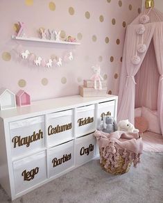 a baby's room decorated in pink and gold