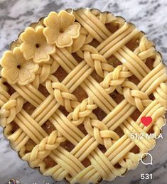 an image of a pie with flowers on it