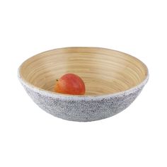 a wooden bowl with a fruit in it