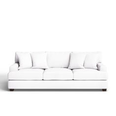 a white couch sitting on top of a wooden floor