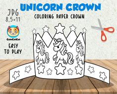 a paper crown with unicorns and stars on it