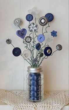 a vase filled with blue flowers on top of a table