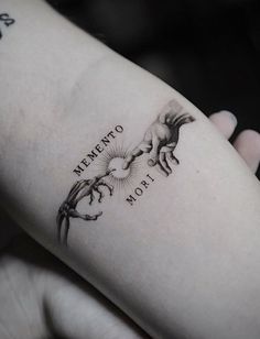 a woman's arm with a tattoo on it that has horses and the words sacramento written in black ink