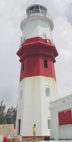 there is a red and white light house