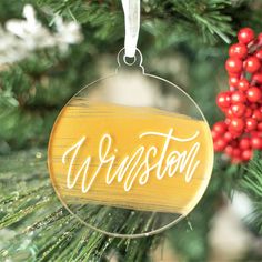 a wooden ornament hanging from a christmas tree