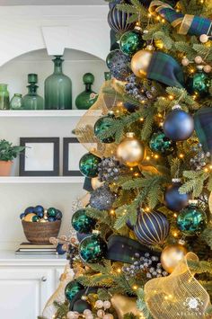 a christmas tree with gold and green ornaments