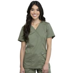 Workwear Revolution | Mock Wrap Nurse Shirt Join the Workwear Revolution with modern, soft, affordable, and oh-so-comfortable nursing scrubs. Uniform scrubs for women enter a new era of ultra-soft, reliable, durable and easy-care options with Cherokee Workwear Revolution. Soft tri-blend fabric is paired with functional utility details for an updated look and feel you'll love. The two-way stretch poly/rayon/spandex fine twill fabric blend feels soft and smooth to the touch. The breathable and eas Scrubs For Women, Green Scrubs, Womens Scrub Tops, Cherokee Woman, Safety Clothing, Top Clothing, Womens Scrubs, Scrubs Nursing, Medical Scrubs