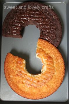 there is a cake in the shape of a letter g on top of a cookie sheet