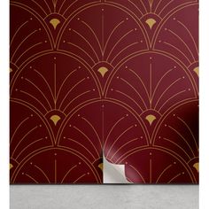 a red and gold art deco wallpaper with an abstract design on the back ground