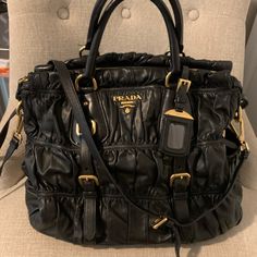 Authentic Prada. A Practical As Your Everyday Bag. Comes With Removable Name Tag, Adjustable Shoulder Strap And Dust Bag. Goldtone Hardware. In Great Condition. See Photos For All The Details. High-end Black Satchel For Errands, Prada Bags, Leather Cross, Everyday Bag, Name Tag, The Details, Camera Bag, Prada, Dust Bag